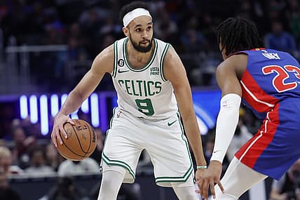 Feb 6, 2023; Detroit, Michigan, USA; Boston Celtics guard Derrick White (9) dribbles defended by Detroit Pistons guard Jaden Ivey (23) in the first half at Little Caesars Arena. Mandatory Credit: Rick Osentoski-USA TODAY Sports