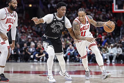 Feb 6, 2023; Chicago, Illinois, USA; Chicago Bulls forward DeMar DeRozan (11) drives to the basket against San Antonio Spurs forward Stanley Johnson (34) during the first half at United Center. Mandatory Credit: Kamil Krzaczynski-USA TODAY Sports