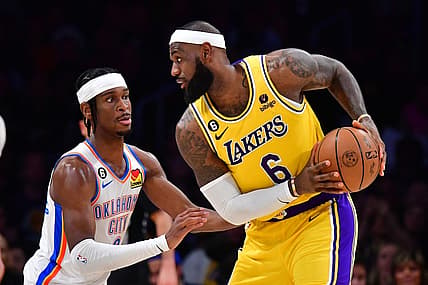 Feb 7, 2023; Los Angeles, California, USA; Oklahoma City Thunder guard Shai Gilgeous-Alexander (2) defends against Los Angeles Lakers forward LeBron James (6) in the second quarter at Crypto.com Arena. Mandatory Credit: Gary A. Vasquez-USA TODAY Sports