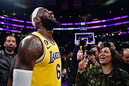 Los Angeles Lakers forward LeBron James (6) celebrates with his mother Gloria James after breaking the all-time scoring record in the third quarter against the Oklahoma City Thunder at Crypto.com Arena. Mandatory Credit: Gary A. Vasquez-USA TODAY Sports