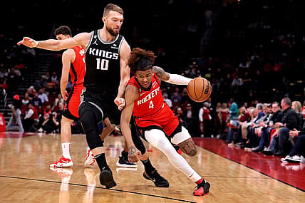 Feb 8, 2023; Houston, Texas, USA; Houston Rockets guard Jalen Green (4) handles the ball against Sacramento Kings forward Domantas Sabonis (10) during the first quarter at Toyota Center. Mandatory Credit: Erik Williams-USA TODAY Sports