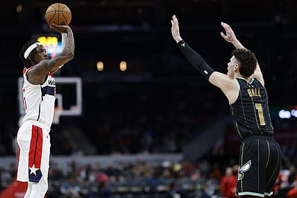 Feb 8, 2023; Washington, District of Columbia, USA; Washington Wizards guard Delon Wright (55) shoots the ball over Charlotte Hornets guard LaMelo Ball (1) in the third quarter at Capital One Arena. Mandatory Credit: Geoff Burke-USA TODAY Sports