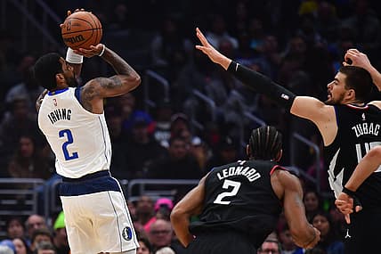 Feb 8, 2023; Los Angeles, California, USA; Dallas Mavericks guard Kyrie Irving (2) shoots against Los Angeles Clippers center Ivica Zubac (40) during the first half at Crypto.com Arena. Mandatory Credit: Gary A. Vasquez-USA TODAY Sports