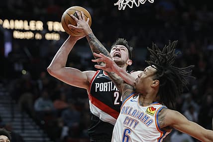 Feb 10, 2023; Portland, Oregon, USA; Portland Trail Blazers power forward Drew Eubanks (24) is fouled while shooting by Oklahoma City Thunder forward Jaylin Williams (6) during the first half at Moda Center. Mandatory Credit: Soobum Im-USA TODAY Sports