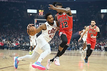 Feb 11, 2023; Cleveland, Ohio, USA; Cleveland Cavaliers guard Donovan Mitchell (45) drives to the basket against Chicago Bulls guard Ayo Dosunmu (12) during the first half at Rocket Mortgage FieldHouse. Mandatory Credit: Ken Blaze-USA TODAY Sports