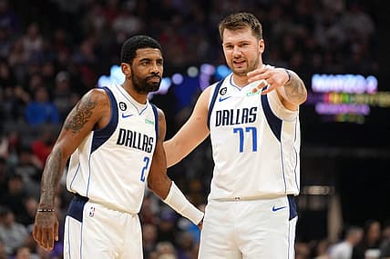 Feb 11, 2023; Sacramento, California, USA; Dallas Mavericks guard Kyrie Irving (2) and guard Luka Doncic (77) talk during the first quarter against the Sacramento Kings at Golden 1 Center. Mandatory Credit: Darren Yamashita-USA TODAY Sports