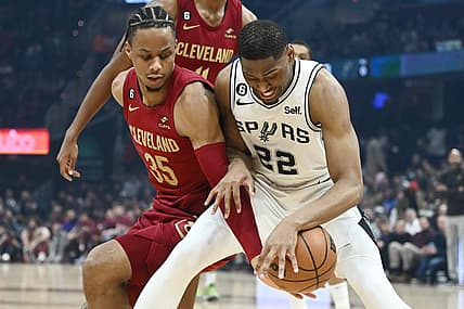 Feb 13, 2023; Cleveland, Ohio, USA; Cleveland Cavaliers forward Isaac Okoro (35) and San Antonio Spurs guard Malaki Branham (22) fight for the ball during the first half at Rocket Mortgage FieldHouse. Mandatory Credit: Ken Blaze-USA TODAY Sports