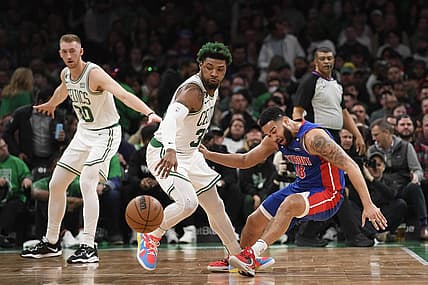 Feb 15, 2023; Boston, Massachusetts, USA; Boston Celtics guard Marcus Smart (36) steals the ball from Detroit Pistons guard Cory Joseph (18) during the first half at TD Garden. Mandatory Credit: Bob DeChiara-USA TODAY Sports