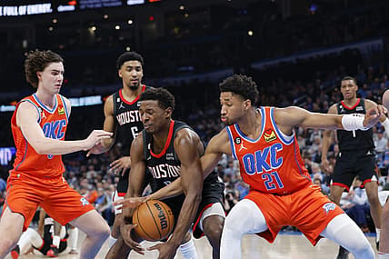 Feb 15, 2023; Oklahoma City, Oklahoma, USA; Houston Rockets forward Jae'Sean Tate (8) looses control of the ball between Oklahoma City Thunder guard Aaron Wiggins (21) and guard Josh Giddey (3) during the second quarter at Paycom Center. Mandatory Credit: Alonzo Adams-USA TODAY Sports