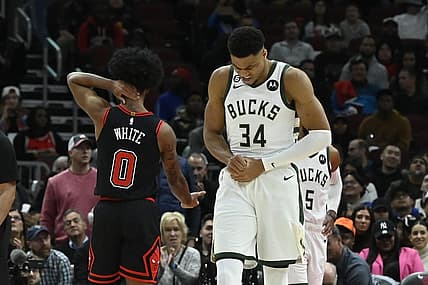 Feb 16, 2023; Chicago, Illinois, USA;  Milwaukee Bucks forward Giannis Antetokounmpo (34) holds his wrist after colliding with Chicago Bulls guard Coby White (0) during the first half at the United Center. Mandatory Credit: Matt Marton-USA TODAY Sports