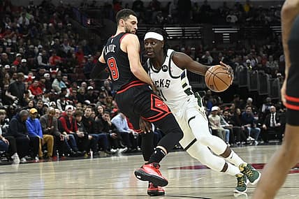 Feb 16, 2023; Chicago, Illinois, USA;  Milwaukee Bucks guard Jrue Holiday (21) drives to the basket against Chicago Bulls guard Zach LaVine (8) during the first half at the United Center. Mandatory Credit: Matt Marton-USA TODAY Sports