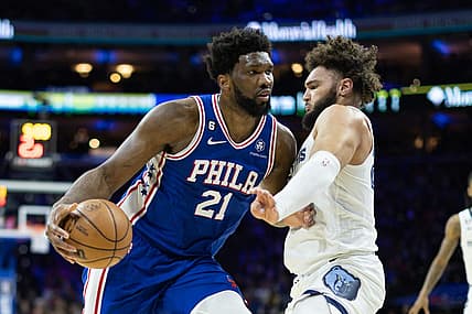 Feb 23, 2023; Philadelphia, Pennsylvania, USA; Philadelphia 76ers center Joel Embiid (21) drives against Memphis Grizzlies forward David Roddy (27) during the second quarter at Wells Fargo Center. Mandatory Credit: Bill Streicher-USA TODAY Sports