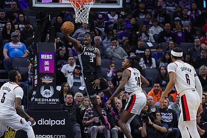 Feb 23, 2023; Sacramento, California, USA; Sacramento Kings guard Terence Davis (3) drives to the basket against Portland Trail Blazers forward Jabari Walker (34) during the second quarter at Golden 1 Center. Mandatory Credit: Sergio Estrada-USA TODAY Sports