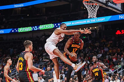 Feb 24, 2023; Atlanta, Georgia, USA; Cleveland Cavaliers forward Evan Mobley (4) and Atlanta Hawks forward Onyeka Okongwu (17) reach for a rebound in the second quarter at State Farm Arena. Mandatory Credit: Brett Davis-USA TODAY Sports