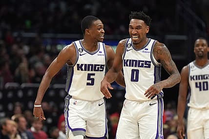 Feb 24, 2023; Los Angeles, California, USA; Sacramento Kings guard De'Aaron Fox (5) and guard Malik Monk (0) celebrate against the LA Clippers in the second half at Crypto.com Arena. The Kings defeated the Clippers 176-175 in double overtime. Mandatory Credit: Kirby Lee-USA TODAY Sports