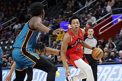 Feb 25, 2023; Detroit, Michigan, USA; Toronto Raptors forward Scottie Barnes (4) dribbles on Detroit Pistons center James Wiseman (13) in the first half at Little Caesars Arena. Mandatory Credit: Rick Osentoski-USA TODAY Sports