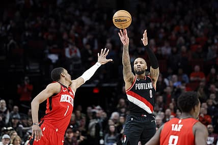 Feb 26, 2023; Portland, Oregon, USA; Portland Trail Blazers point guard Damian Lillard (0) shoots the ball over Houston Rockets power forward Jabari Smith Jr. (1) during the second half at Moda Center. Mandatory Credit: Soobum Im-USA TODAY Sports