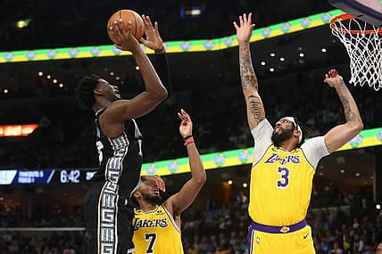 Feb 28, 2023; Memphis, Tennessee, USA; Memphis Grizzlies forward Jaren Jackson Jr. (13) shoots as Los Angeles Lakers forward Anthony Davis (3) defends during the first half at FedExForum. Mandatory Credit: Petre Thomas-USA TODAY Sports