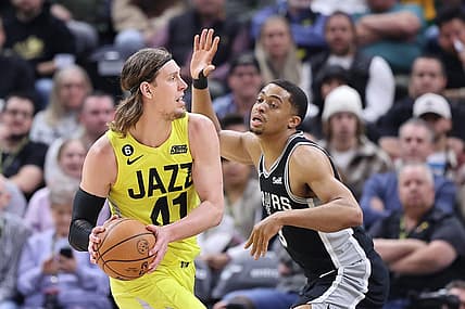Feb 28, 2023; Salt Lake City, Utah, USA; Utah Jazz forward Kelly Olynyk (41) passes against San Antonio Spurs forward Keldon Johnson (3) in the second quarter at Vivint Arena. Mandatory Credit: Rob Gray-USA TODAY Sports