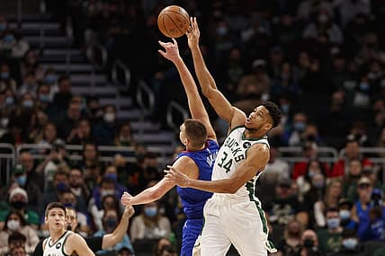 Jan 30, 2022; Milwaukee, Wisconsin, USA;  Milwaukee Bucks forward Giannis Antetokounmpo (34) and Denver Nuggets center Nikola Jokic (15) reach for the ball during the first quarter at Fiserv Forum. Mandatory Credit: Jeff Hanisch-USA TODAY Sports