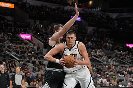 Nov 7, 2022; San Antonio, Texas, USA;  Denver Nuggets center Nikola Jokic (15) drives in against San Antonio Spurs center Jakob Poeltl (25) in the second half at the AT&T Center. Mandatory Credit: Daniel Dunn-USA TODAY Sports