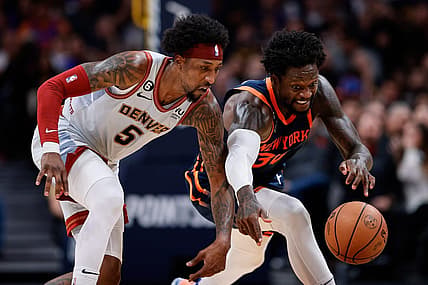Nov 16, 2022; Denver, Colorado, USA; Denver Nuggets guard Kentavious Caldwell-Pope (5) and New York Knicks forward Julius Randle (30) battle for a loose ball in the fourth quarter at Ball Arena. Mandatory Credit: Isaiah J. Downing-USA TODAY Sports