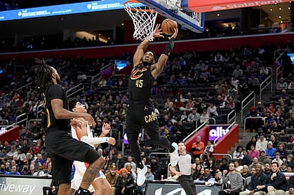 Nov 27, 2022; Detroit, Michigan, USA;  Cleveland Cavaliers guard Donovan Mitchell (45) tries to finish off an alley-oop against the Detroit Pistons in the second quarter at Little Caesars Arena. Mandatory Credit: Lon Horwedel-USA TODAY Sports