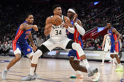 Jan 23, 2023; Detroit, Michigan, USA; Milwaukee Bucks forward Giannis Antetokounmpo's (34) drives to the basket against Detroit Pistons guard Rodney McGruder (17) (left) and center Jalen Duran (0) in the third quarter at Little Caesars Arena. Mandatory Credit: Lon Horwedel-USA TODAY Sports
