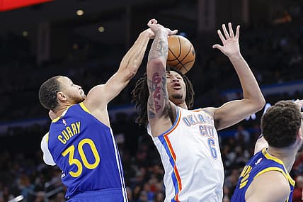Jan 30, 2023; Oklahoma City, Oklahoma, USA; Golden State Warriors guard Stephen Curry (30) strips the ball away from Oklahoma City Thunder forward Jaylin Williams (6) during the second half at Paycom Center. Mandatory Credit: Alonzo Adams-USA TODAY Sports