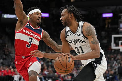 Jan 30, 2023; San Antonio, Texas, USA;  San Antonio Spurs forward Keita Bates-Diop (31) drives against Washington Wizards guard Bradley Beal (3) in the second half at the AT&T Center. Mandatory Credit: Daniel Dunn-USA TODAY Sports