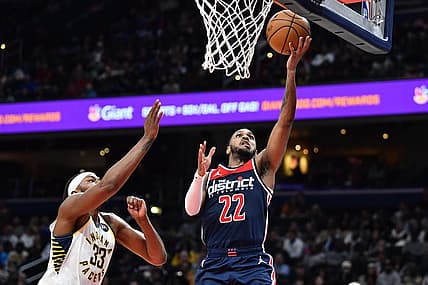 Feb 11, 2023; Washington, District of Columbia, USA; Washington Wizards guard Monte Morris (22) shoots as Indiana Pacers center Myles Turner (33) looks on during the second half at Capital One Arena. Mandatory Credit: Brad Mills-USA TODAY Sports