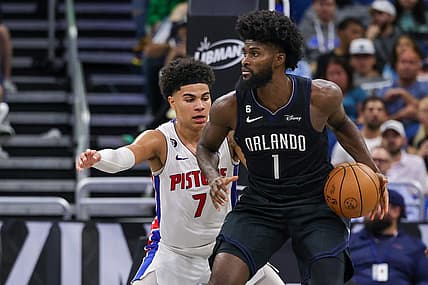 Feb 23, 2023; Orlando, Florida, USA; Detroit Pistons guard Killian Hayes (7) defends Orlando Magic forward Jonathan Isaac (1) during the second half at Amway Center. Mandatory Credit: Mike Watters-USA TODAY Sports