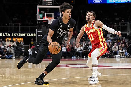 Feb 26, 2023; Atlanta, Georgia, USA; Brooklyn Nets forward Cameron Johnson (2) dribbles past Atlanta Hawks guard Trae Young (11) during the first half at State Farm Arena. Mandatory Credit: Dale Zanine-USA TODAY Sports