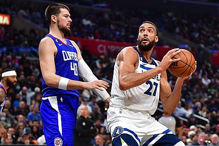 Feb 28, 2023; Los Angeles, California, USA; Minnesota Timberwolves center Rudy Gobert (27) moves to the basket against Los Angeles Clippers center Ivica Zubac (40) during the second half at Crypto.com Arena. Mandatory Credit: Gary A. Vasquez-USA TODAY Sports