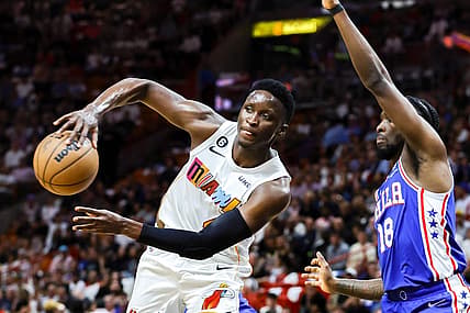 Mar 1, 2023; Miami, Florida, USA; Miami Heat guard Victor Oladipo (4) passes the basketball as Philadelphia 76ers guard Shake Milton (18) defends during the second quarter at Miami-Dade Arena. Mandatory Credit: Sam Navarro-USA TODAY Sports