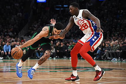 Mar 3, 2023; Boston, Massachusetts, USA;  Brooklyn Nets forward Dorian Finney-Smith (28) defends Boston Celtics forward Jayson Tatum (0) during the first half at TD Garden. Mandatory Credit: Bob DeChiara-USA TODAY Sports