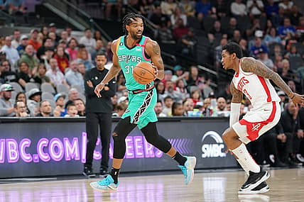 Mar 4, 2023; San Antonio, Texas, USA;  San Antonio Spurs forward Keita Bates-Diop dribbles up court during the first quarter of a game against the Houston Rockets at the AT&T Center. Mandatory Credit: Aaron Meullion-USA TODAY Sports