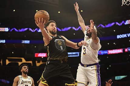 Mar 5, 2023; Los Angeles, California, USA; Golden State Warriors guard Klay Thompson (11) goes to the basket against Los Angeles Lakers forward Anthony Davis (3) during the first quarter at Crypto.com Arena. Mandatory Credit: Kiyoshi Mio-USA TODAY Sports