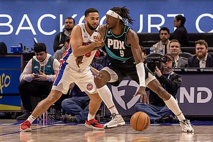 Mar 6, 2023; Detroit, Michigan, USA; Detroit Pistons guard Cory Joseph (18) defends against Portland Trail Blazers forward Jerami Grant (9) during the first quarter at Little Caesars Arena. Mandatory Credit: David Reginek-USA TODAY Sports