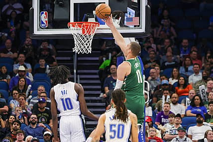 Mar 7, 2023; Orlando, Florida, USA; Milwaukee Bucks center Brook Lopez (11) goes to the basket against Orlando Magic center Bol Bol (10) during the second quarter at Amway Center. Mandatory Credit: Mike Watters-USA TODAY Sports