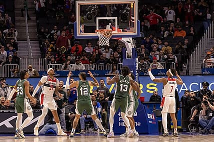 Mar 7, 2023; Detroit, Michigan, USA; Washington Wizards center Daniel Gafford (21) shoots the game winning basket as time runs out against the Detroit Pistons in the fourth quarter at Little Caesars Arena. Mandatory Credit: David Reginek-USA TODAY Sports