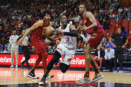 Mar 8, 2023; Miami, Florida, USA; Miami Heat center Bam Adebayo (13) drives to the basket ahead of Cleveland Cavaliers center Jarrett Allen (31) and forward Evan Mobley (4) during the first quarter at Miami-Dade Arena. Mandatory Credit: Sam Navarro-USA TODAY Sports