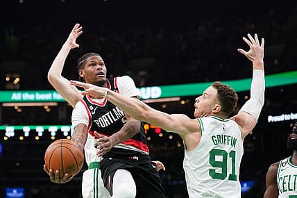 Mar 8, 2023; Boston, Massachusetts, USA; Portland Trail Blazers Cam Reddish (5)  shoots against Boston Celtics forward Blake Griffin (91) in the first quarter at TD Garden. Mandatory Credit: David Butler II-USA TODAY Sports