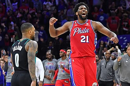 Mar 10, 2023; Philadelphia, Pennsylvania, USA; Philadelphia 76ers center Joel Embiid (21) celebrates win over Portland Trail Blazers guard Damian Lillard (0) at Wells Fargo Center. Mandatory Credit: Eric Hartline-USA TODAY Sports