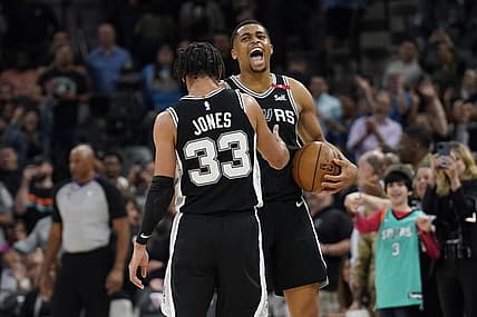 Mar 10, 2023; San Antonio, Texas, USA; San Antonio Spurs forward Keldon Johnson (3) and guard Tre Jones (33) react after a victory over the Denver Nuggets at AT&T Center. Mandatory Credit: Scott Wachter-USA TODAY Sports