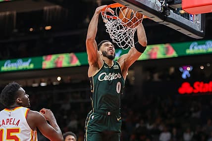 Mar 11, 2023; Atlanta, Georgia, USA; Boston Celtics forward Jayson Tatum (0) dunks against the Atlanta Hawks in the first quarter at State Farm Arena. Mandatory Credit: Brett Davis-USA TODAY Sports