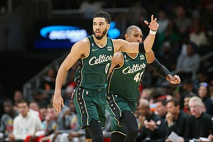 Mar 11, 2023; Atlanta, Georgia, USA; Boston Celtics forward Jayson Tatum (0) reacts after a three-pointer as center Al Horford (42) looks on against the Atlanta Hawks in the second half at State Farm Arena. Mandatory Credit: Brett Davis-USA TODAY Sports