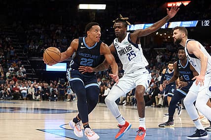 Mar 11, 2023; Memphis, Tennessee, USA; Memphis Grizzlies guard Desmond Bane (22) drives to the basket as Dallas Mavericks forward Reggie Bullock (25) defends during the second half at FedExForum. Mandatory Credit: Petre Thomas-USA TODAY Sports