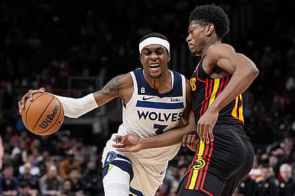 Mar 13, 2023; Atlanta, Georgia, USA; Minnesota Timberwolves guard Jordan McLaughlin (6) dribbles against Atlanta Hawks forward De'Andre Hunter (12) during the first half at State Farm Arena. Mandatory Credit: Dale Zanine-USA TODAY Sports