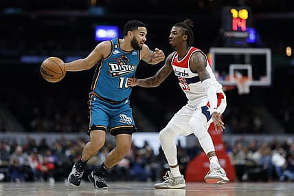 Mar 14, 2023; Washington, District of Columbia, USA; Detroit Pistons guard Cory Joseph (18) dribbles the ball as Washington Wizards guard Delon Wright (55) defends in the second quarter at Capital One Arena. Mandatory Credit: Geoff Burke-USA TODAY Sports